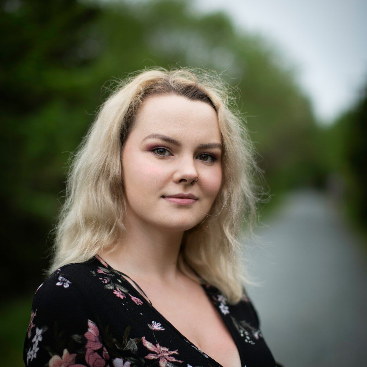 woman in black and white floral shirt